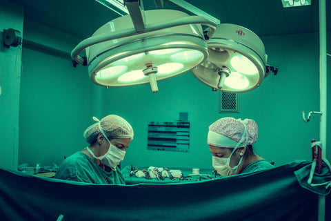 Two surgeons working in an operating room