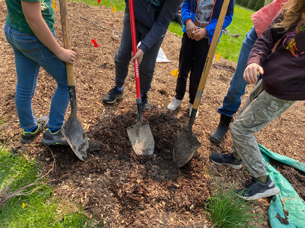 kids with shovels from Madeleine-de-Roybon Elementary prepare for a Little Forest