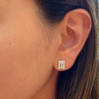 emerald cut diamond earrings on ear