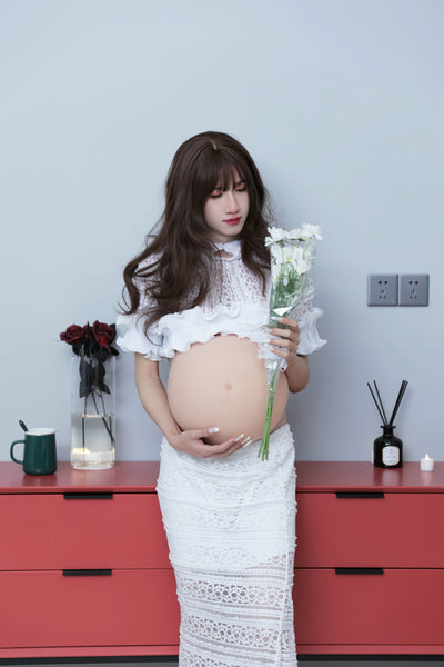 Model wearing KUMIHO pregnant belly costume