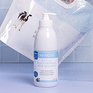 MooGoo Milk Shampoo Bottle in blue shower