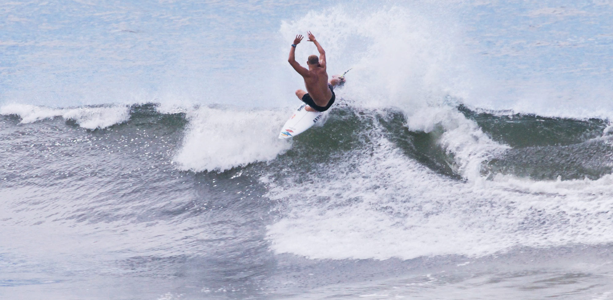 Mick Fanning throwing fins