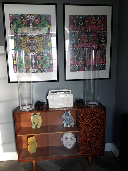 Art posters and vintage hand decorated cabinet