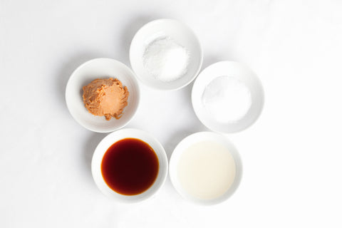 Japanese Basic seasoning; from the top clockwise: sugar, salt, vinegar, soy sauce and miso