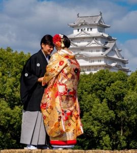 Japanese bride and groom at Himeji Castle