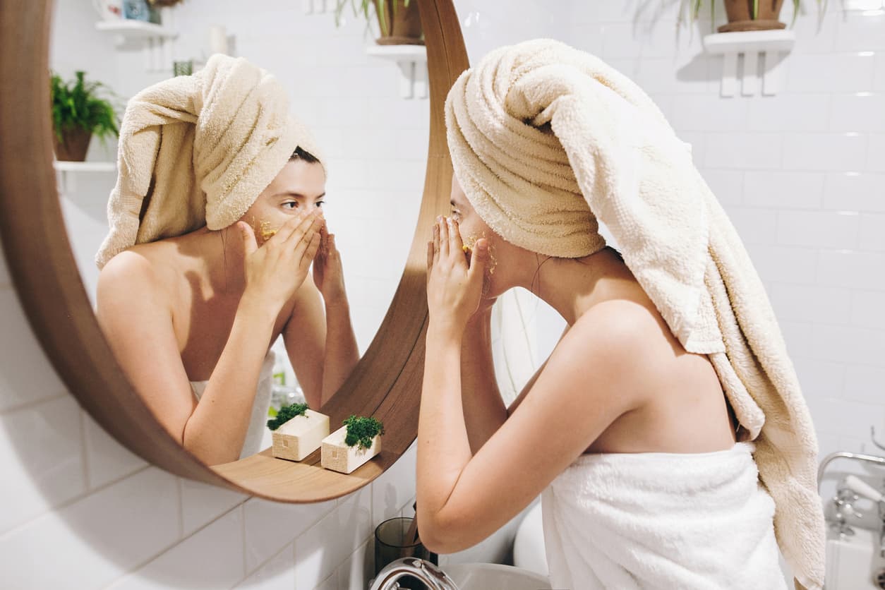 woman applying face scrub