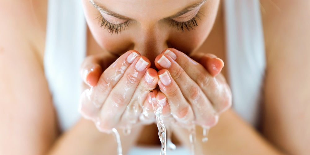 woman washing face