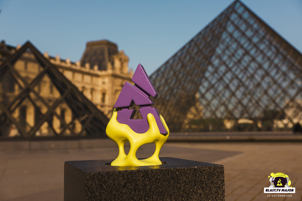 The Blast.tv Paris Major 2023 custom trophy in front of the L'Ouvre museum.