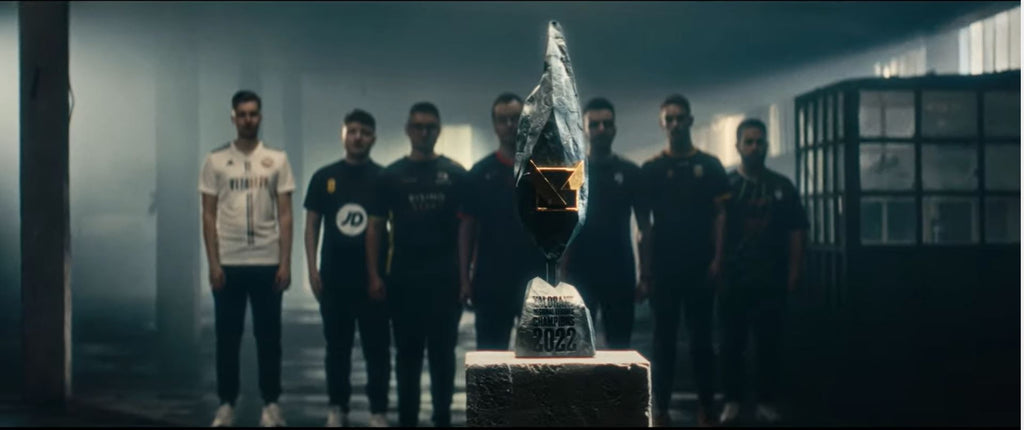 Yurii from Case Esports, Alvar from Team Falcons, Youbreak from Team Tenstar, Foxie from team Excel, H1ber from team Vitality, Afoxx from team Angry Titans, and Mrfalin from team FUT Esports standing behind the Valorant Regional Leagues Champions trophy.