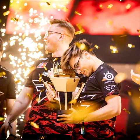 Esport team FaZe clan lifting the PGL Major Antwerp 2022 custom trophy.