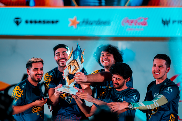 Esport team Geekay Esports lifting their custom trophy during the Intel Arabian Cup.