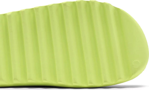 The adidas Yeezy Slides ‘Glow Green’ treats Kanye West’s slip-on sandal to a vivid makeover. A monochromatic neon green hue is applied to the plush build, crafted from a single piece of injected EVA foam. Exterior branding is limited to adidas’ signature three-stripes stamped on the soft top layer of the footbed. Underfoot, deep horizontal grooves are cut into the outsole, offering a blend of impact protection and grippy traction.