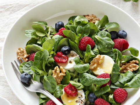 Bowl of berry and goat cheese saled