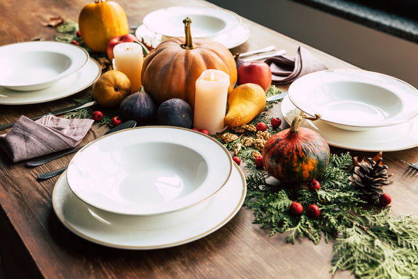 hosting must haves white plates with fall table decorations