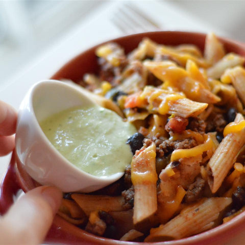 Bison meat recipe with penne noodles, black beans, cheddar cheese, and tomatoes.