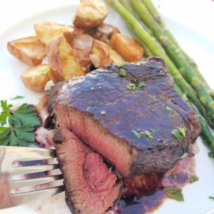 Bison meat recipe for a filet with red wine butter sauce.