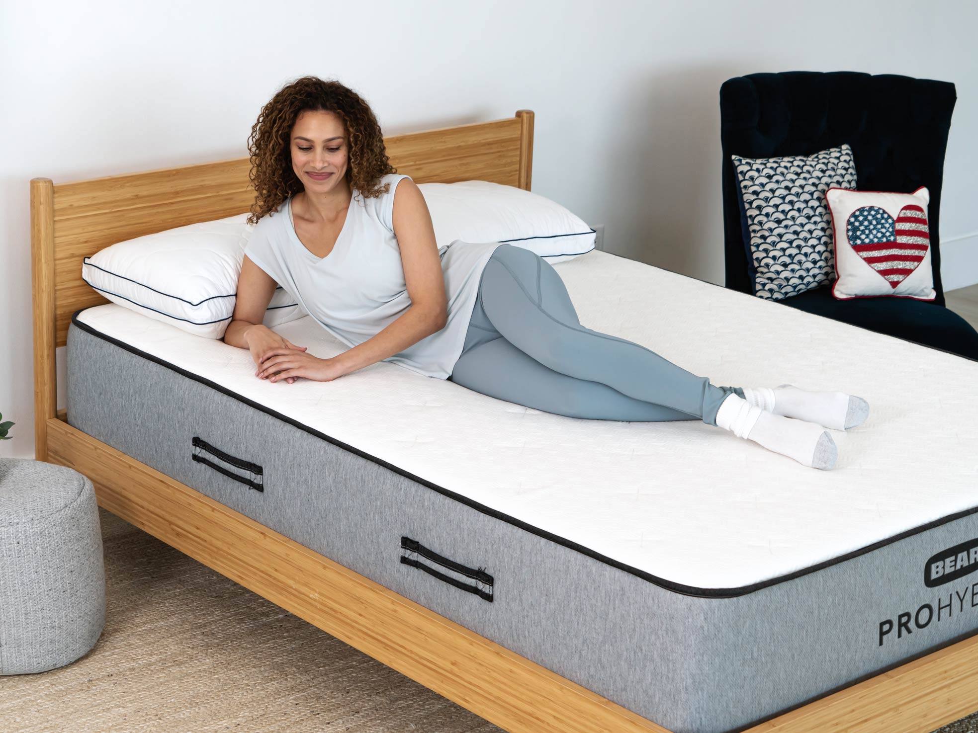 Person lounging on their side on the Pro Hybrid mattress