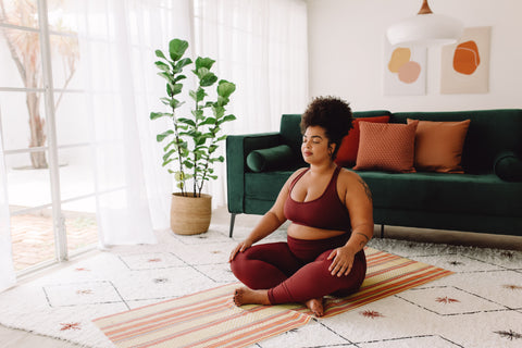 A woman meditating in the morning