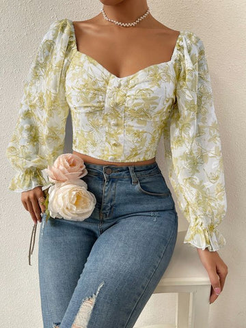a long sleeved blouse with floral prints