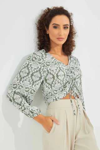 a woman wearing a printed long sleeves blouse
