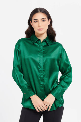 a woman wearing green blouse