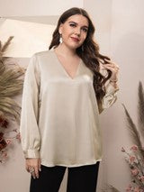 a woman wearing a long sleeves  blouse