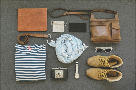 clothes, camera, watch, camera, belt and a bag