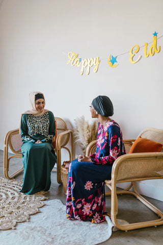 women wearing dresses and jalabiya