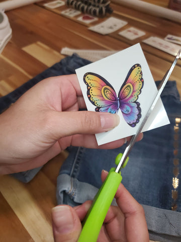 Cutting the butterfly tattoo