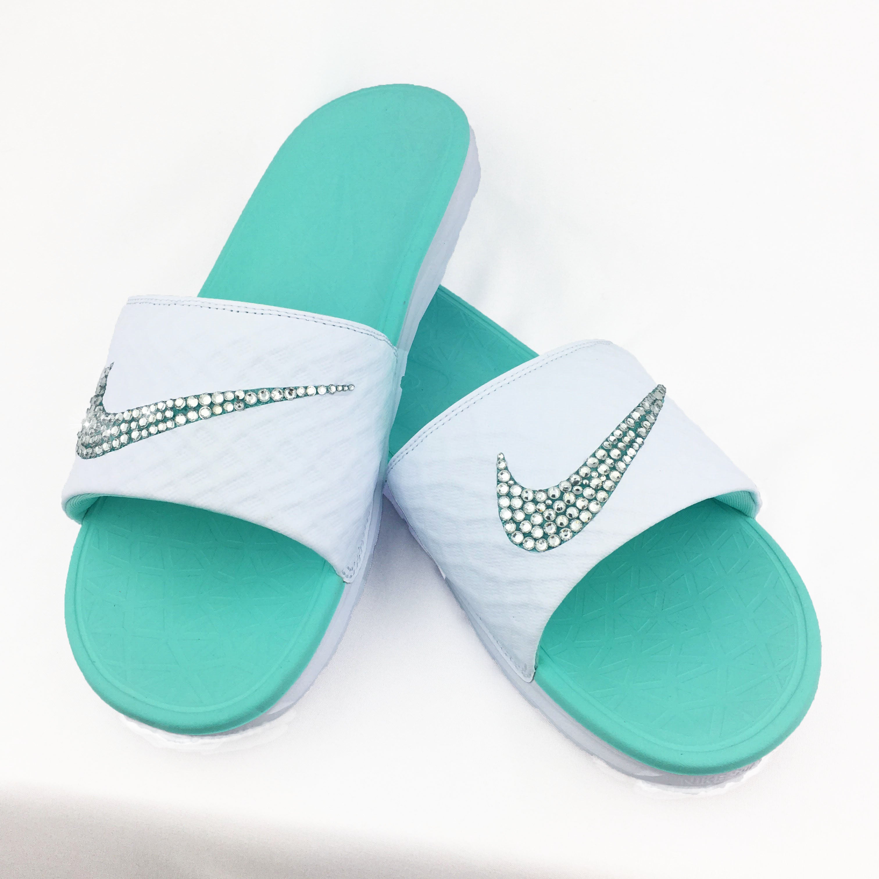 teal and white nike slides