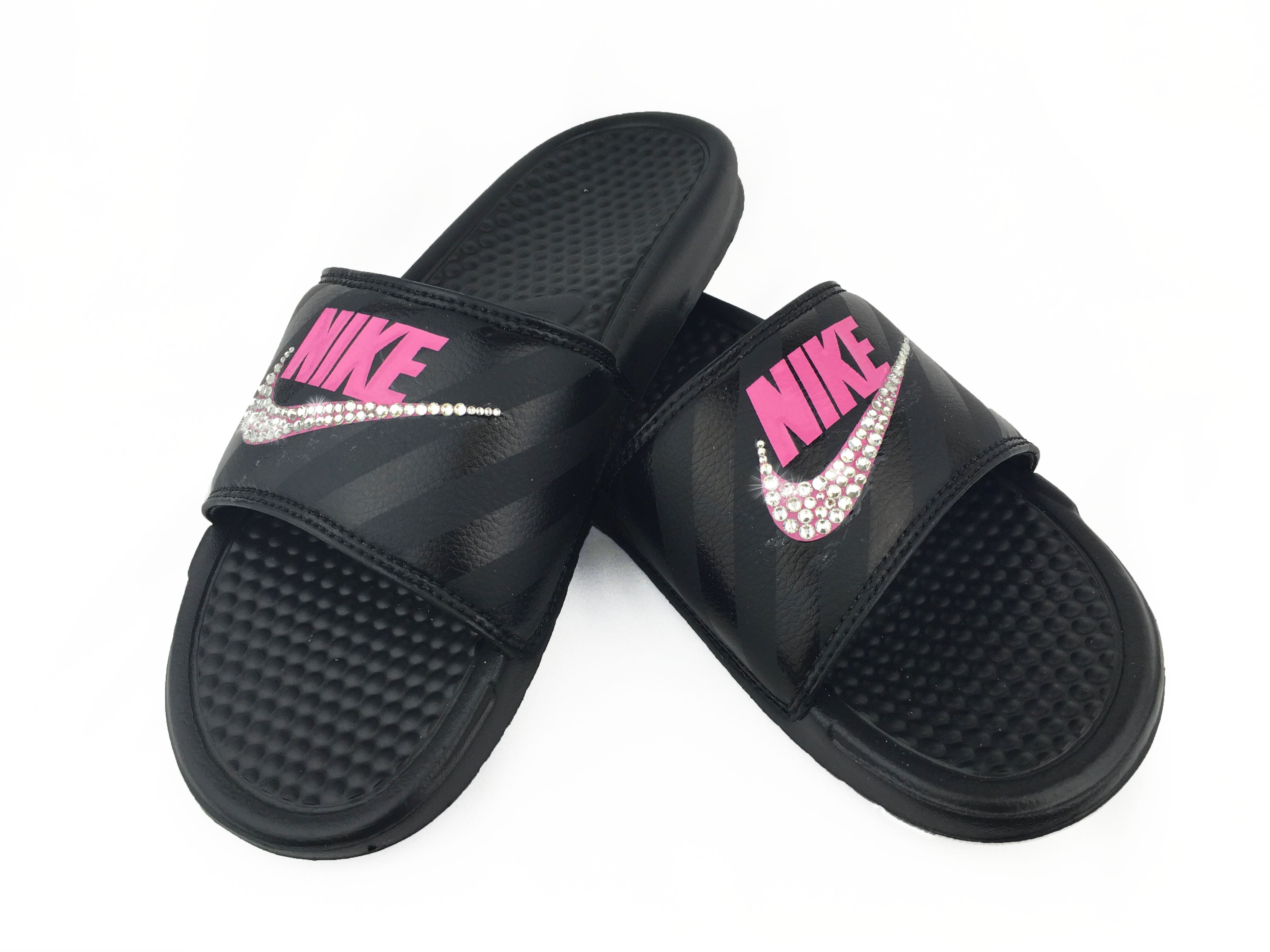 pink and black nike flip flops