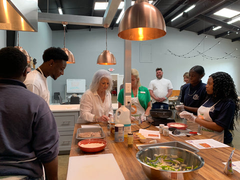 Paula Deen Helping in Full Circle Kitchen