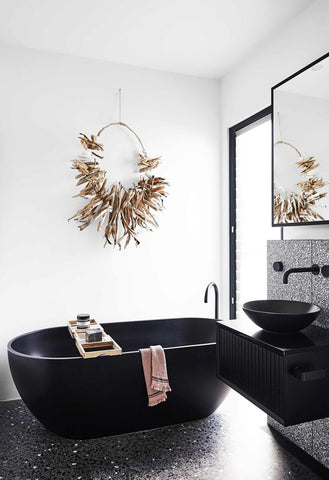 dark terrazzo tile in bathroom