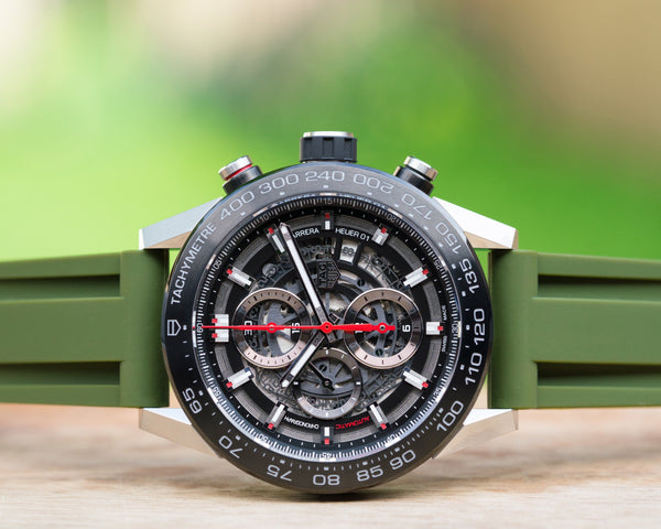 https://cdn.shopify.com/s/files/1/0662/2047/products/tag-heuer-carrera-olive-green-rubber-watch-band_600x.jpg?v=1615592860