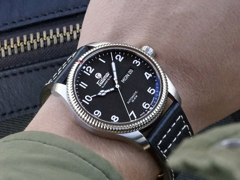 A Tutima man's watch on a wrist is an example of a popular watch brands for your collection