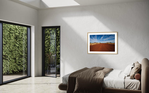 framed wall art landscape photo of mountain in a bedroom