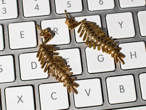 Gold feather earrings