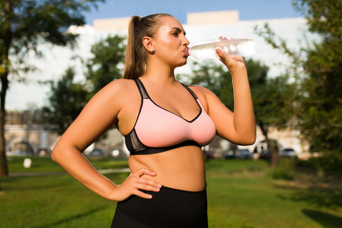 Plus-size-woman-hydrating-water