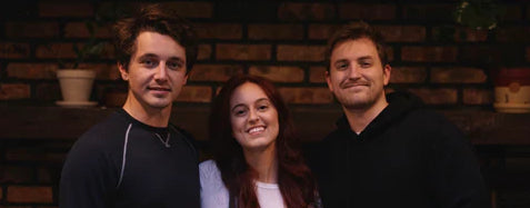 (left to right) Taylor, Robyn, and Chris standing together smiling