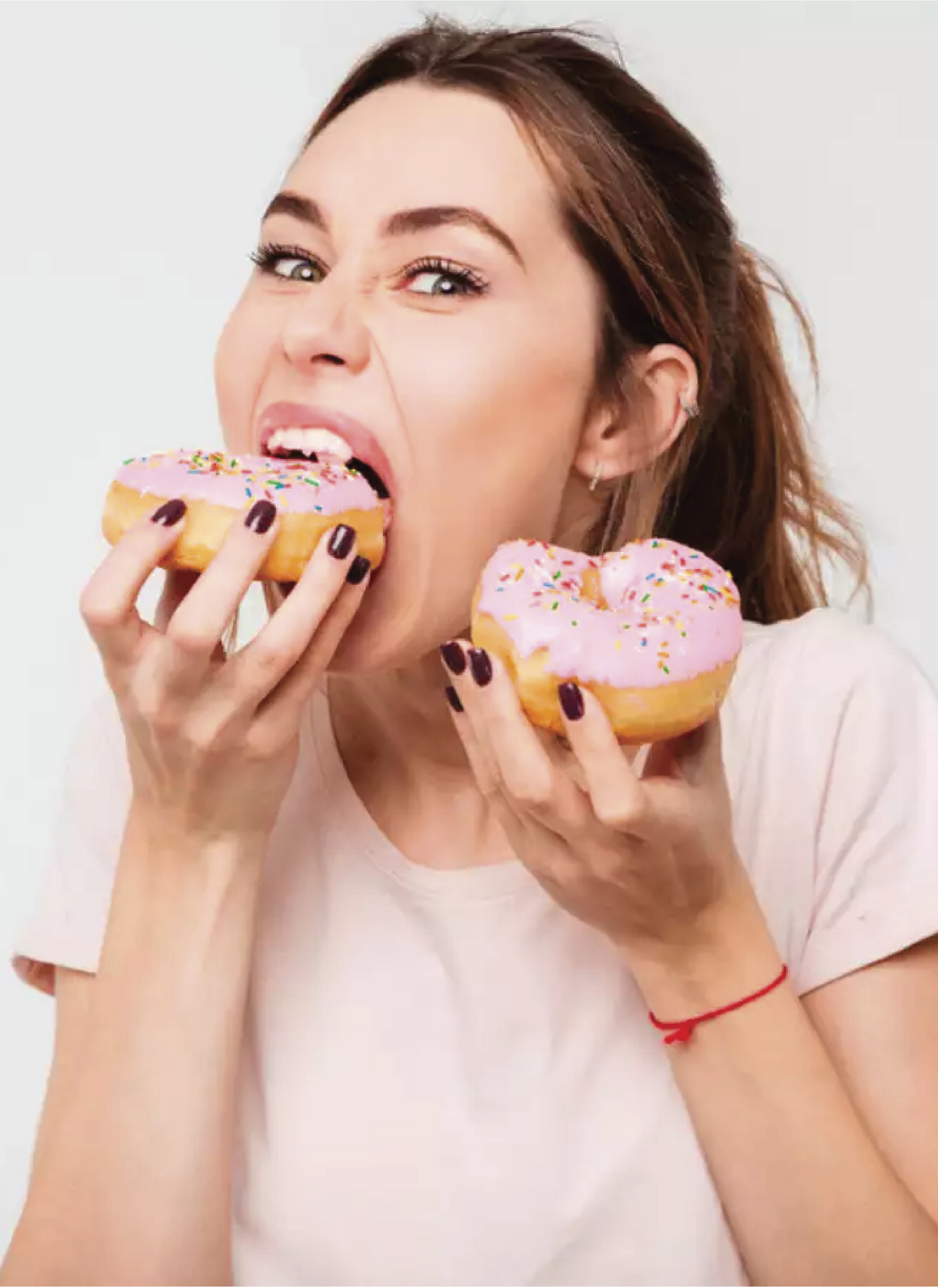 Woman Eating Donuts - BN Healthy