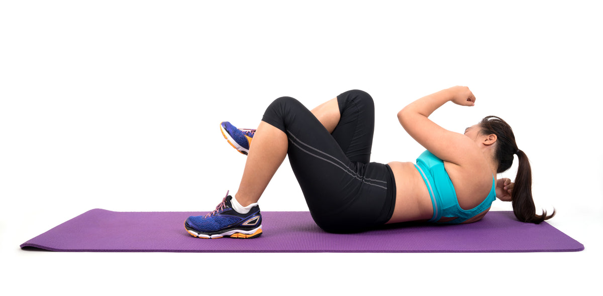 Woman Exercising on Mat - BN Healthy