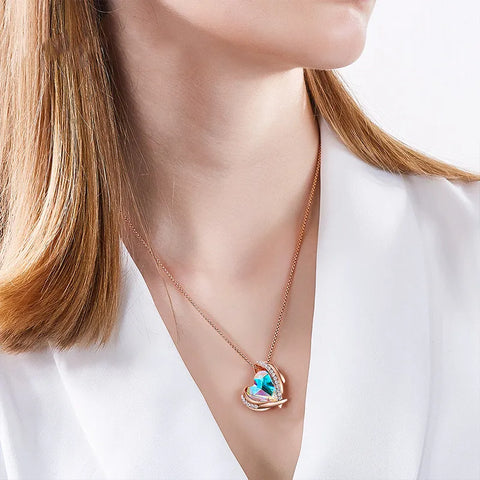 a woman wearing angel heart necklace for women