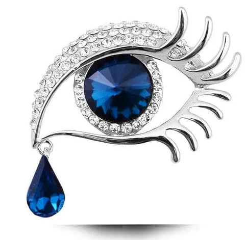 diamond-encrusted tear eye design brooch white and blue