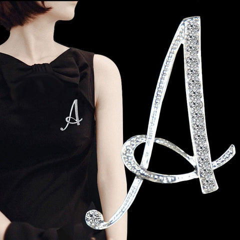 a woman wearing a diamonds english letter brooches letter A