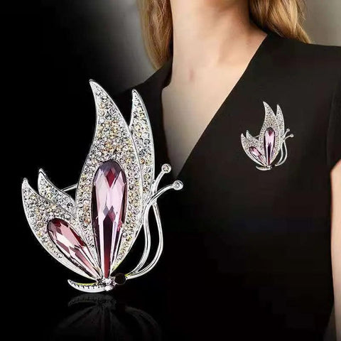 a woman wearing the butterfly fashion alloy jewelry ladies corsage on black dress