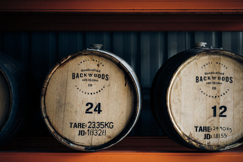 Two barrels of whisky on a rack