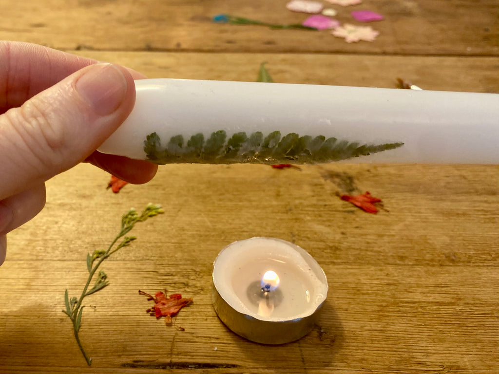 Candle decorating with pressed flower