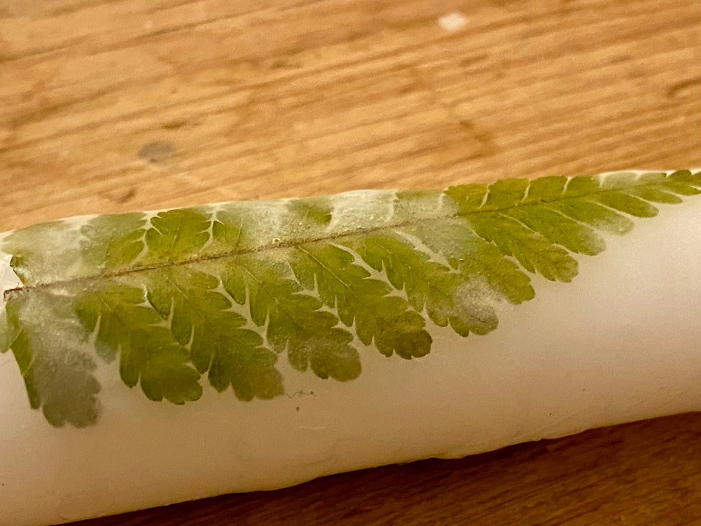 Candle decorating with pressed flower