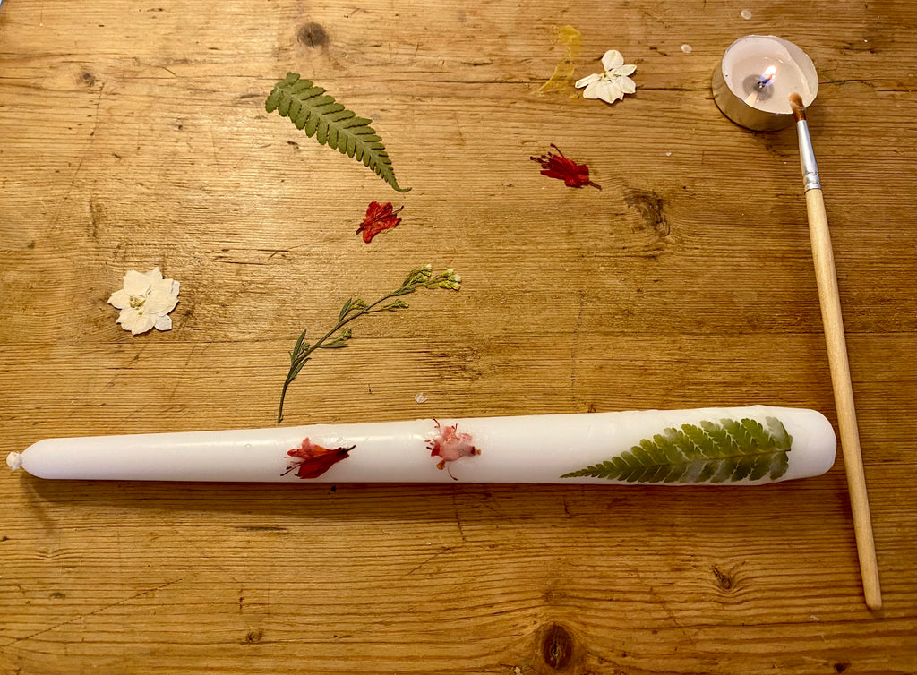 Candle decorating with pressed flowers