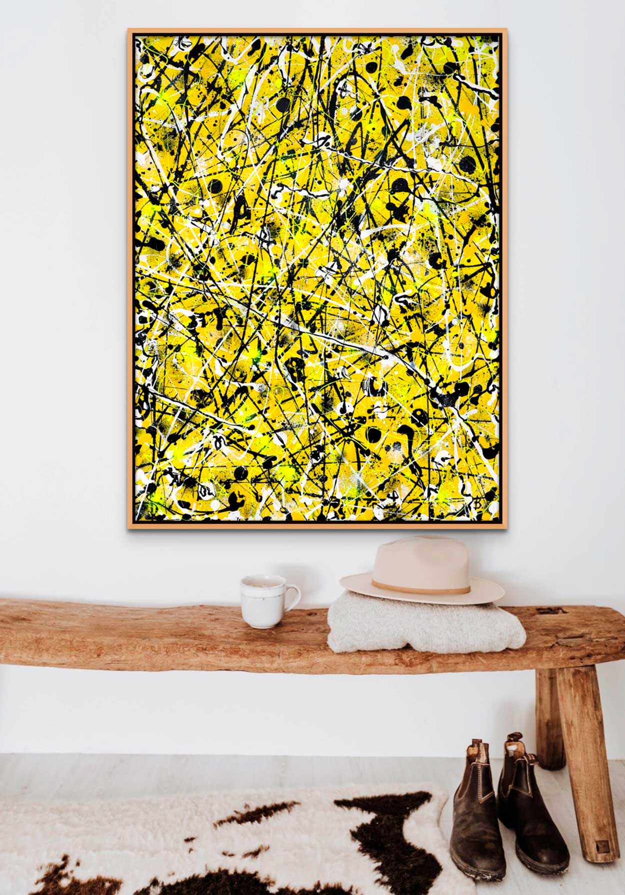 Image of 'Beehive' original abstract painting seen hanging above wooden bench, boots and rug. Artwork painted by Bridget Bradley, Abstract expressionist Artist, Australia